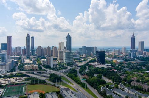 Atlanta skyline and regional real estate market spanning diverse neighborhoods and nearby suburbs