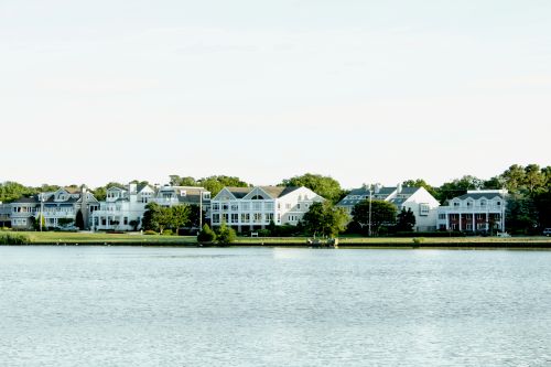 Delaware skyline and regional real estate market spanning metro suburbs and coastal statewide communities