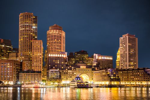 Massachusetts skyline and statewide real estate market spanning major cities and suburban communities
