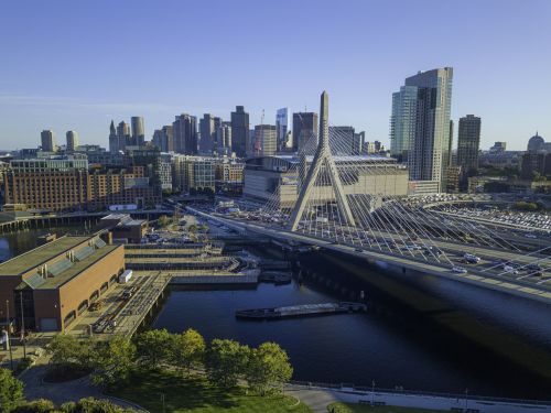 Boston skyline and historic metro real estate market with housing demand across nearby suburbs