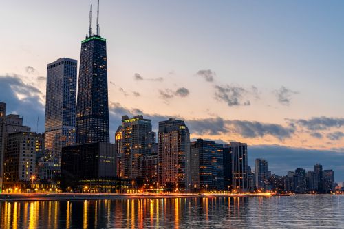Chicago skyline and Midwest real estate market with housing activity across nearby suburbs