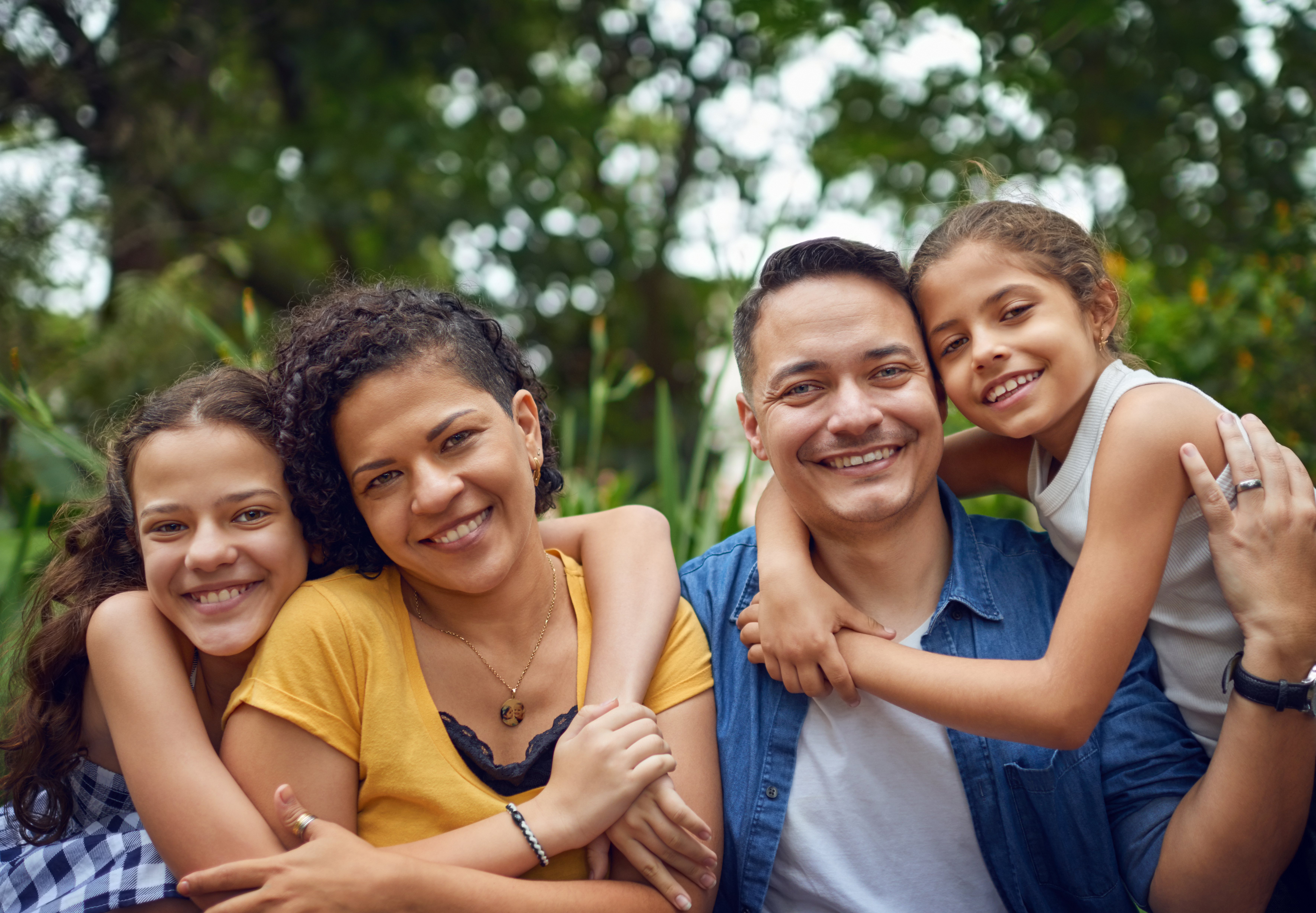 A cropped portrait of a happy family spending quality time together in their Suffolk, VA home