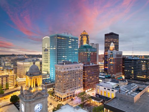 Iowa skyline and statewide real estate market spanning metro suburbs and regional communities