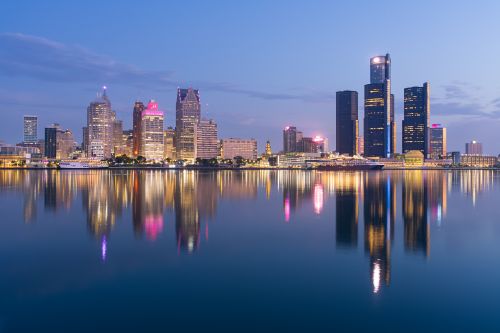 Michigan skyline and regional real estate market with housing activity across metro areas and suburban communities