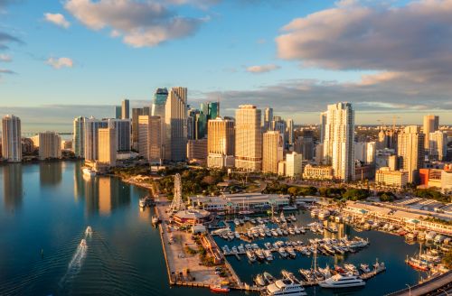 Miami skyline and South Florida real estate market spanning coastal neighborhoods and nearby suburbs