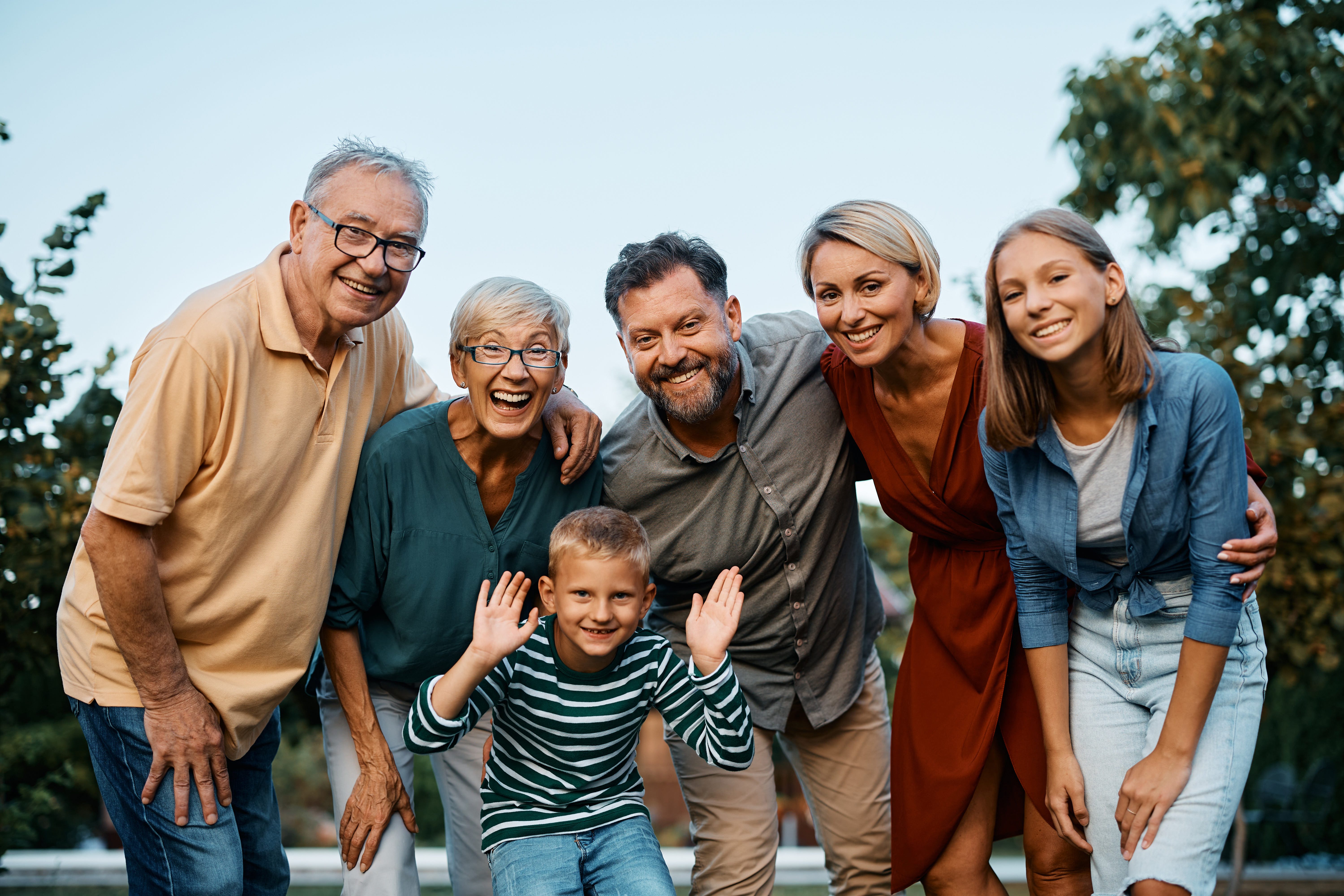 A happy family smiling together in an urban park setting in Hampton, Virginia