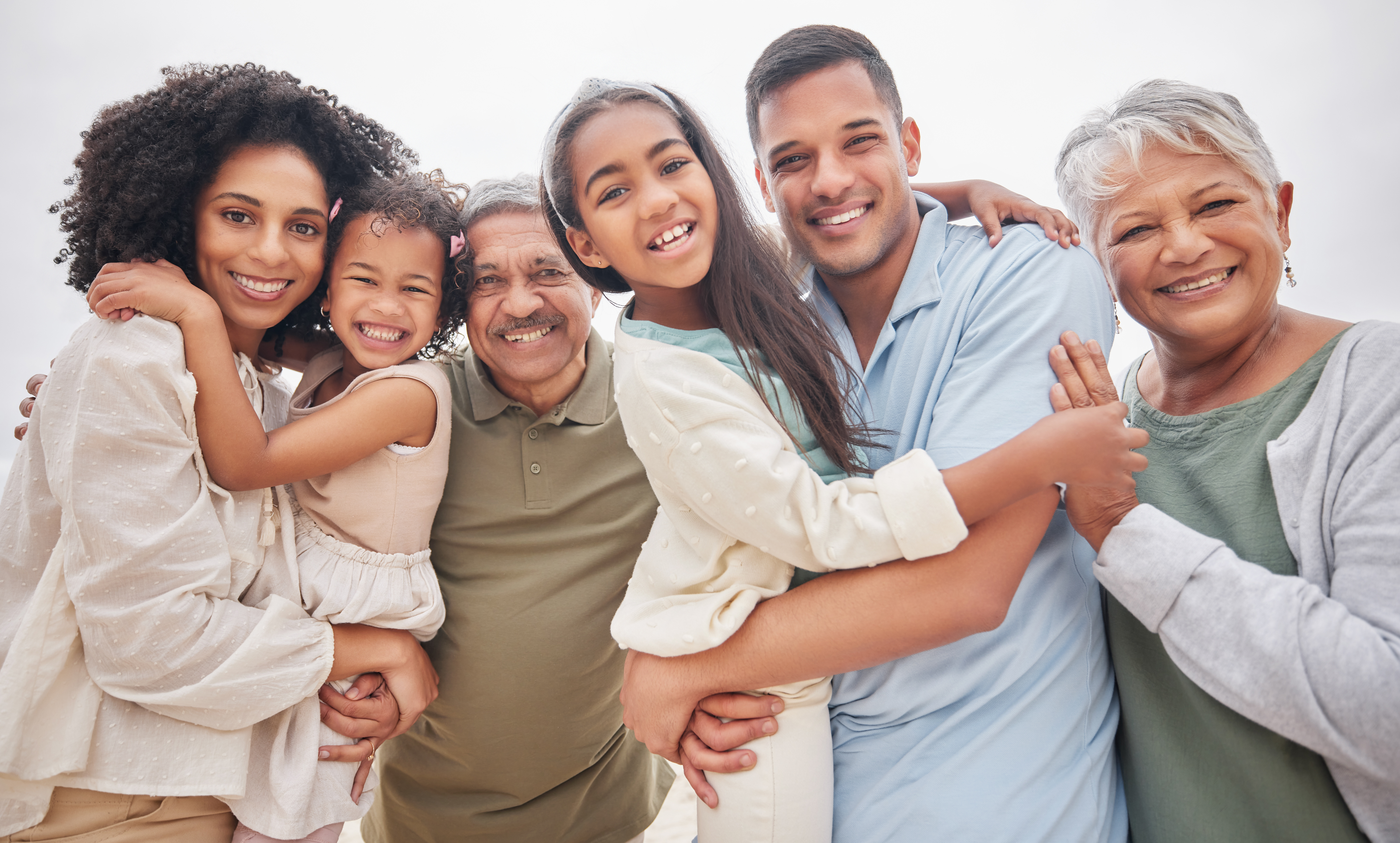A happy multi-generational family including grandparents smiling together in Colonial Heights, VA