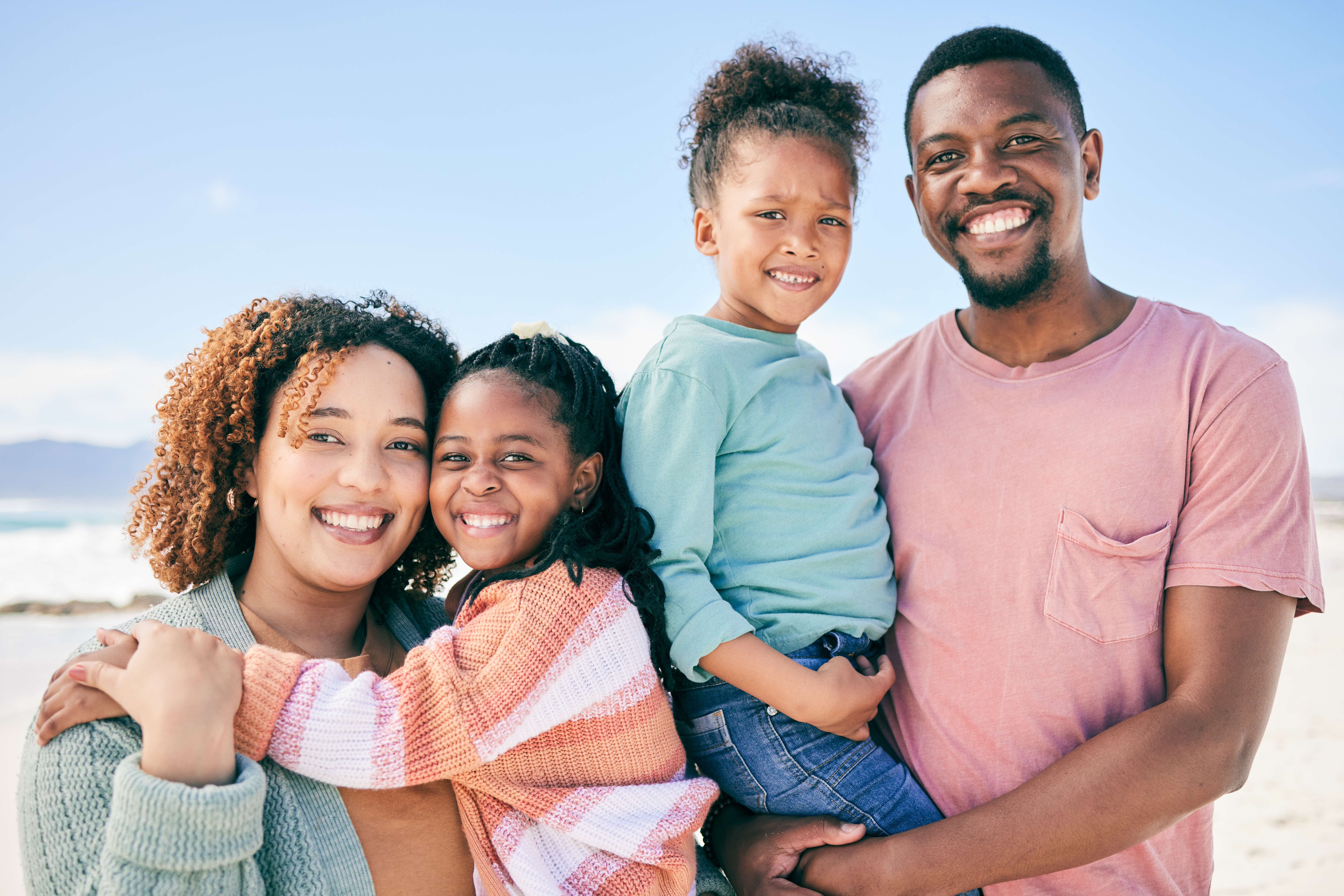A portrait of a happy Black family smiling together while on holiday in Towson, MD