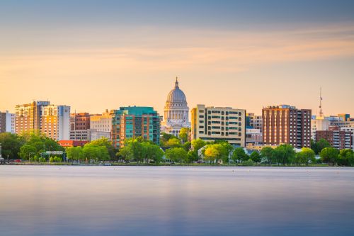 Wisconsin skyline and statewide real estate market spanning Milwaukee suburbs and regional communities