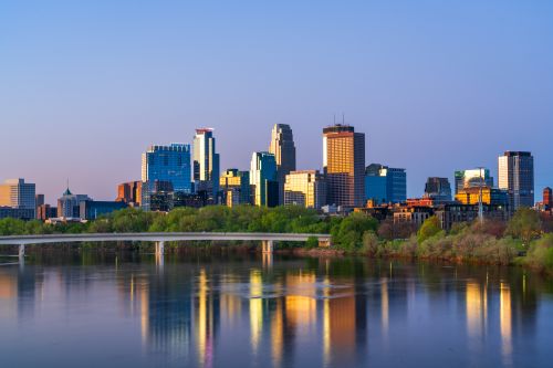 Minnesota skyline and regional real estate market with housing activity across Twin Cities suburbs and statewide communities