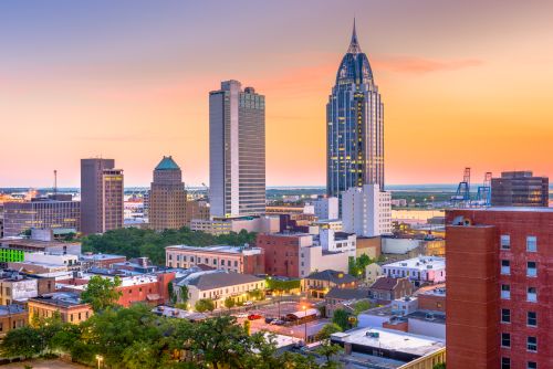 Alabama skyline and statewide real estate market spanning metro suburbs and smaller regional communities