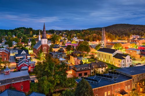 Vermont skyline and rural New England real estate market with housing activity across statewide communities