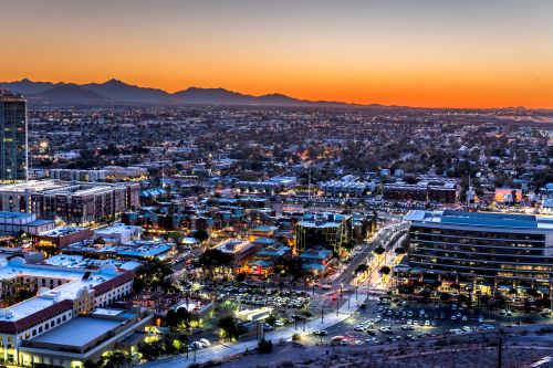 Phoenix skyline and desert metro real estate market spanning nearby suburbs and growing communities