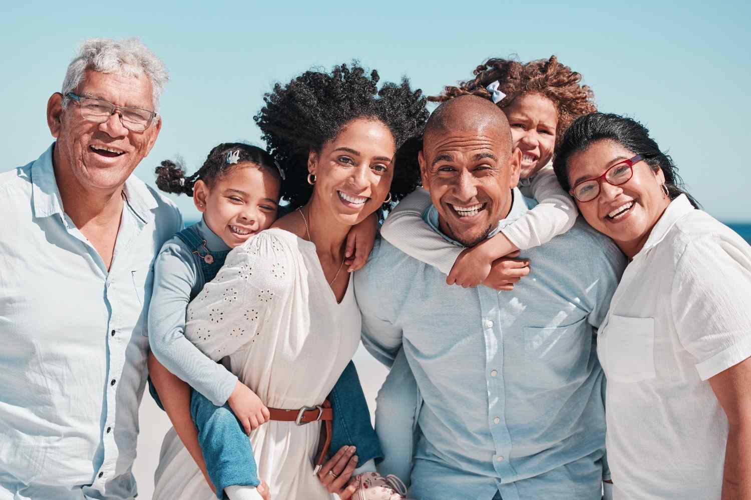 A portrait of a large, happy family smiling together during a vacation outing in Midlothian, VA