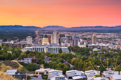 Utah skyline and Mountain West real estate market with housing activity across growing suburbs and statewide communities
