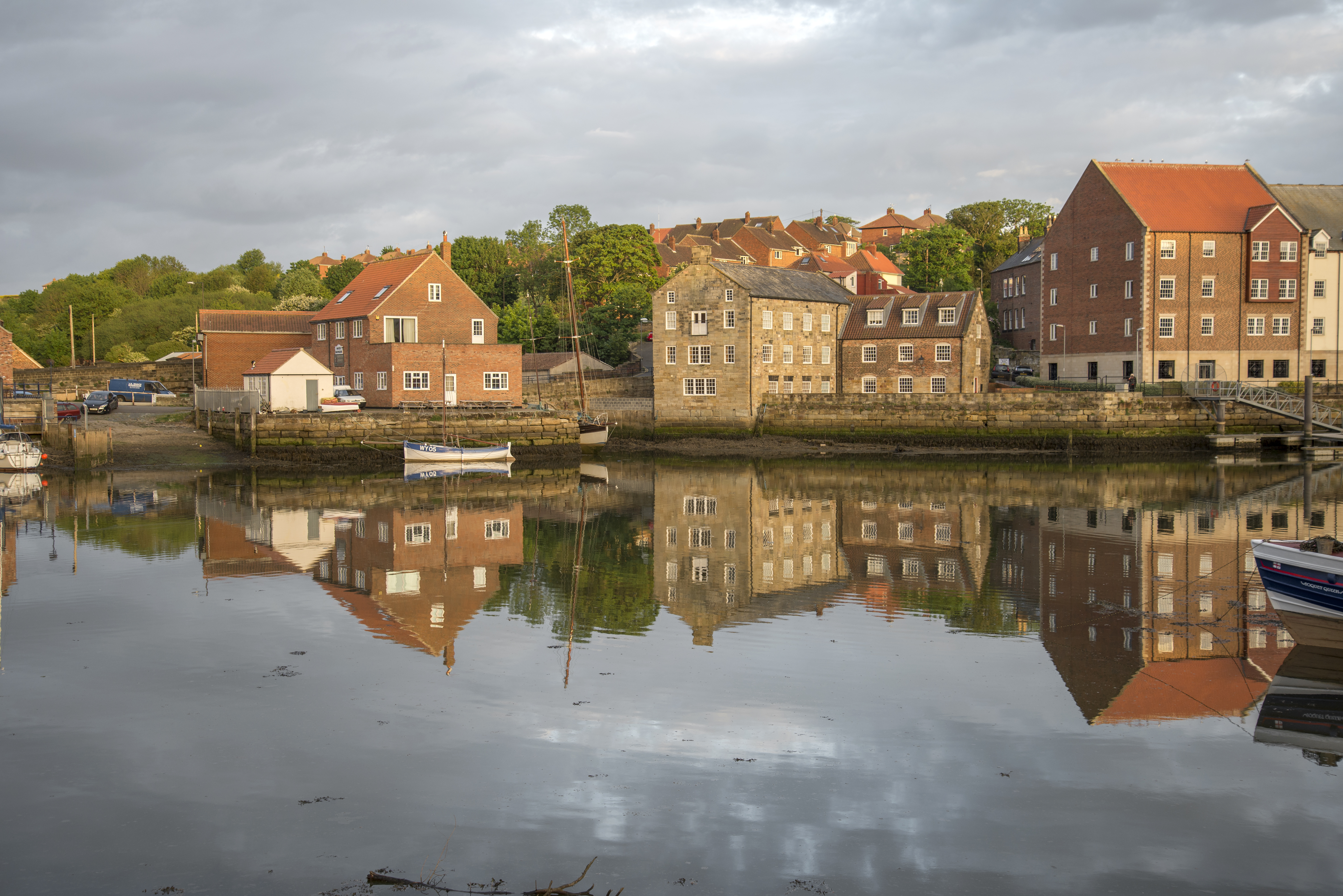 Scenic waterside town with buildings reflecting in the water in Pasadena, Maryland