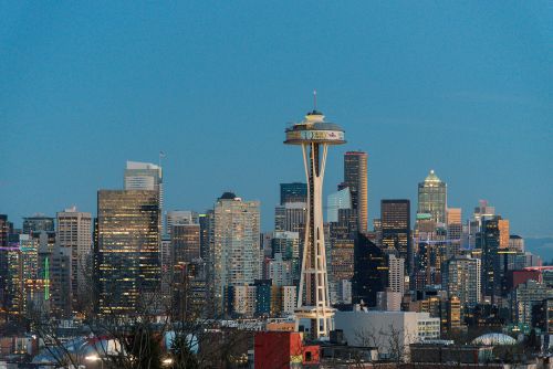Seattle skyline and Pacific Northwest real estate market spanning nearby suburbs and local communities