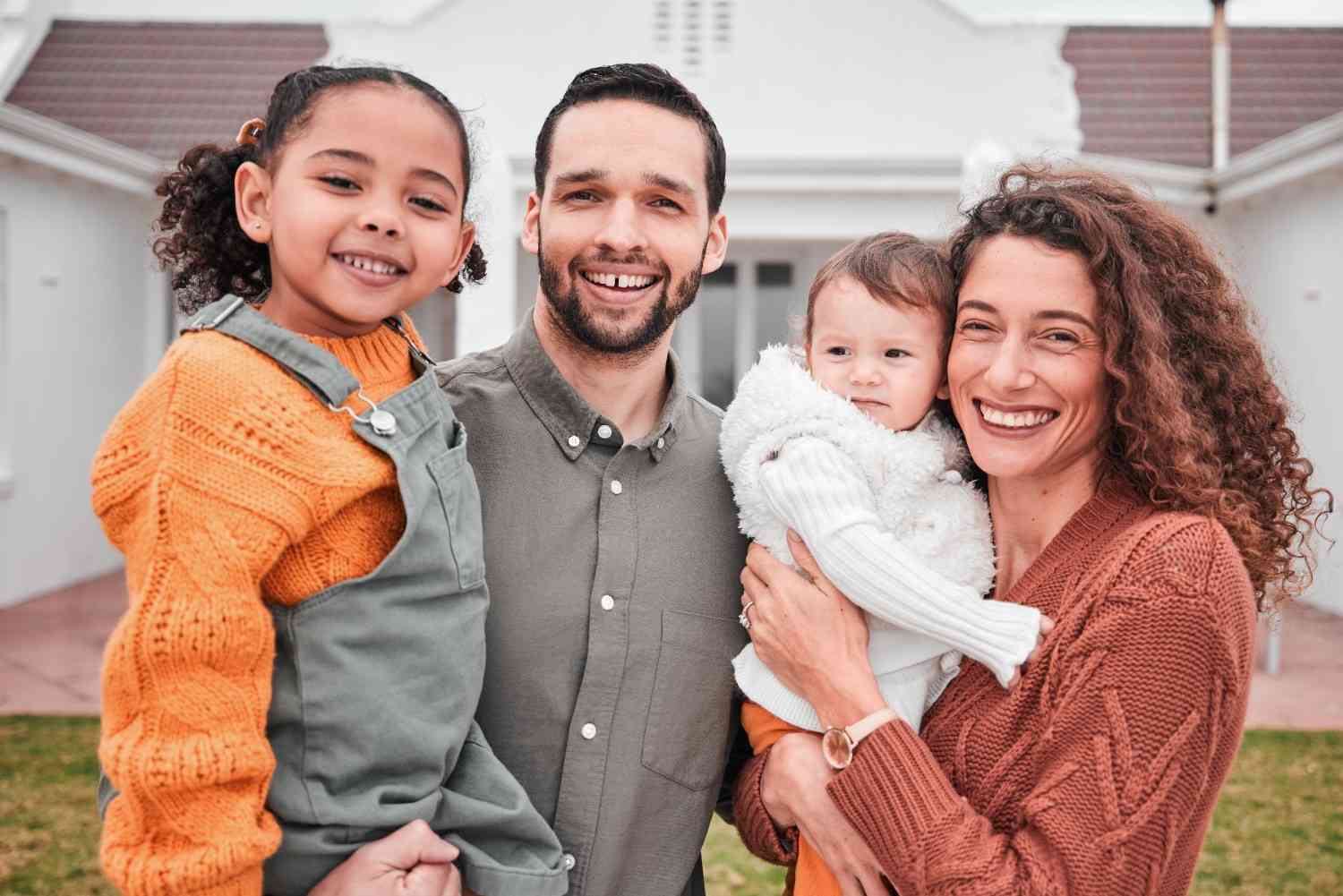 A smiling family posing for a portrait in the comfort of their Annapolis, MD home