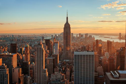 New York skyline and statewide real estate market spanning urban centers and surrounding suburban regions
