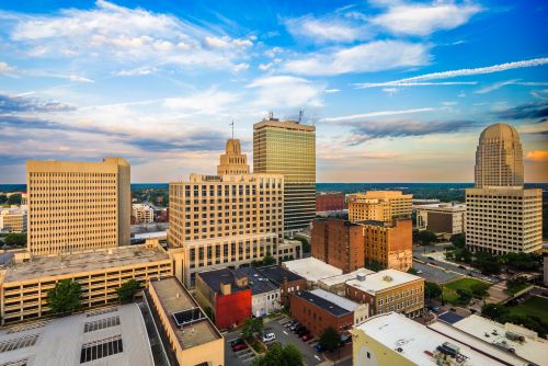 North Carolina skyline and regional real estate market with housing activity across metro areas and growing suburbs