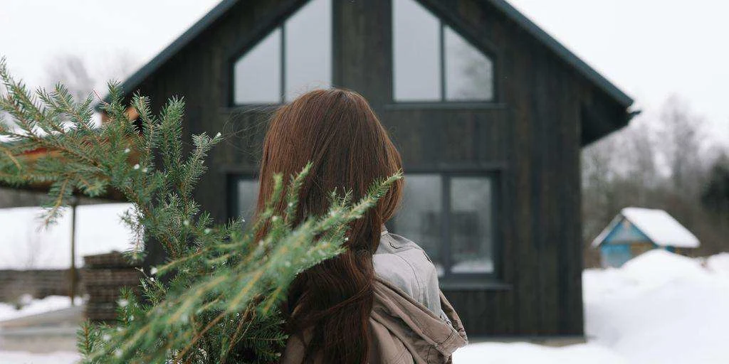 woman in front of a home