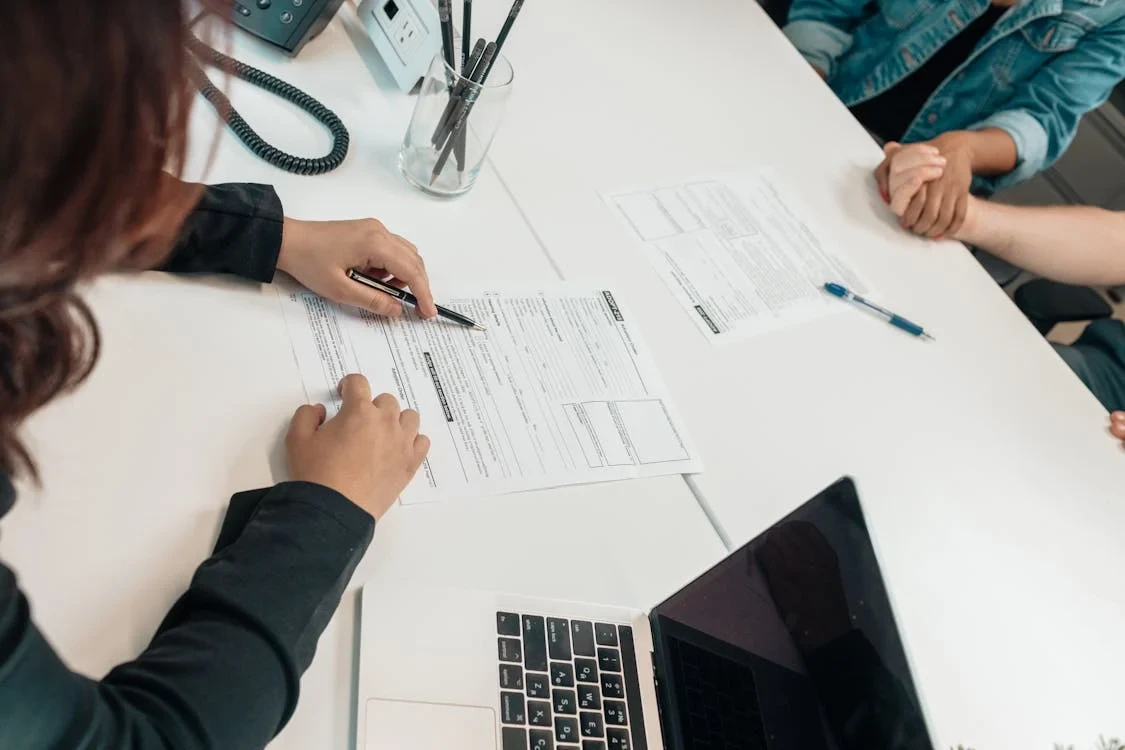 people going over a document
