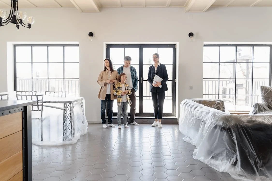 a family inside a house with new furniture