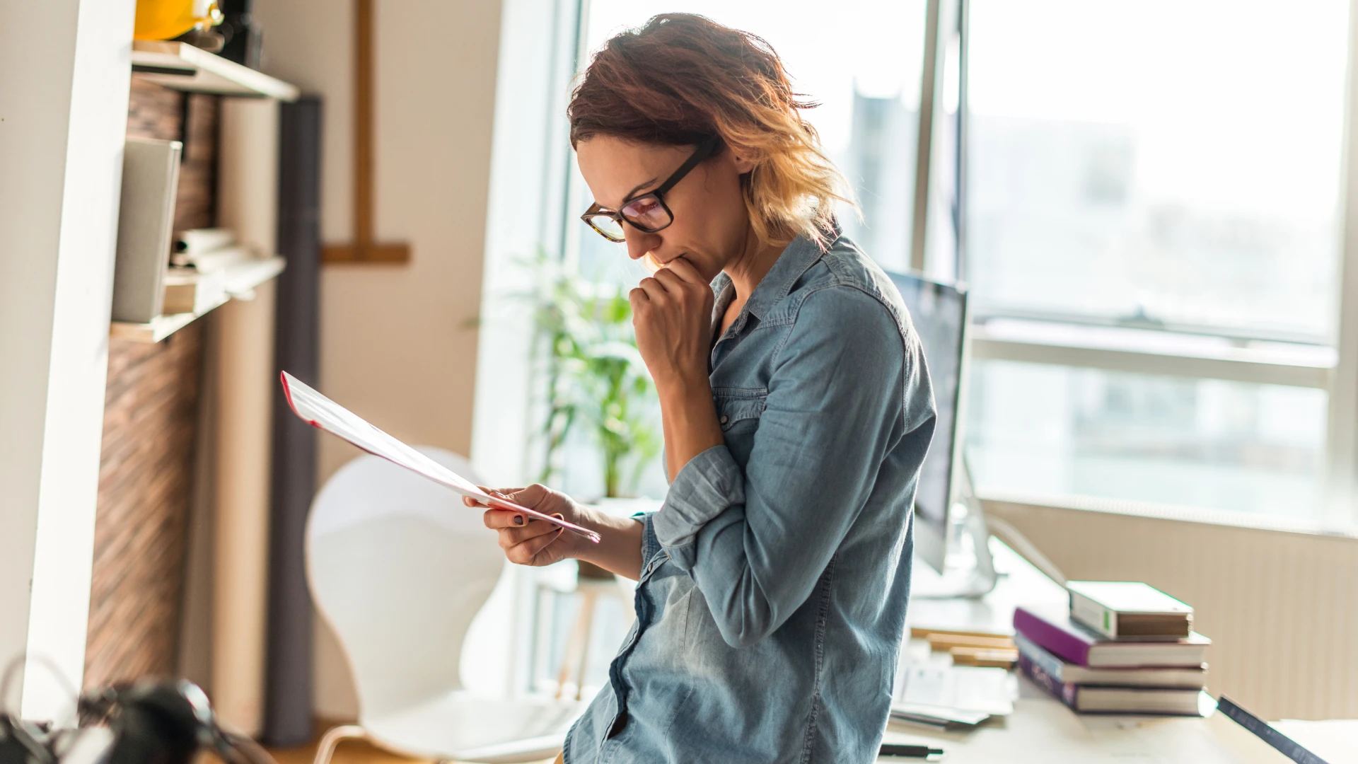 Woman reading house purchase contract