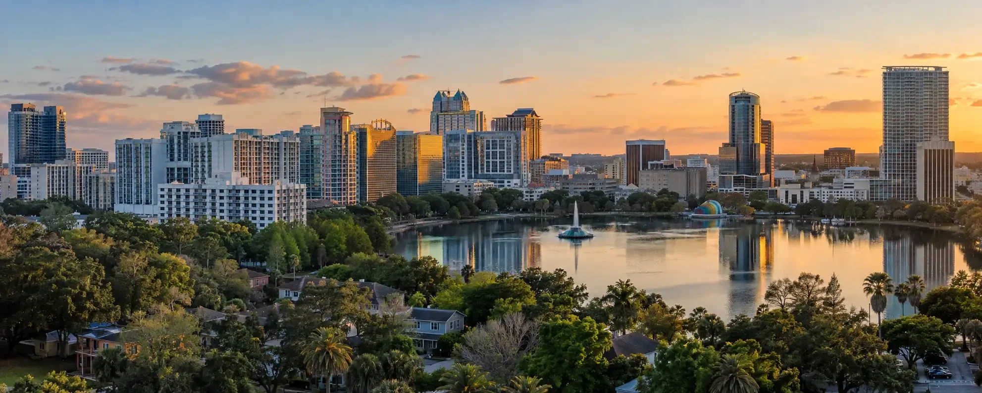 Aerial view of Orlando neighborhoods around Lake Eola with the downtown skyline behind