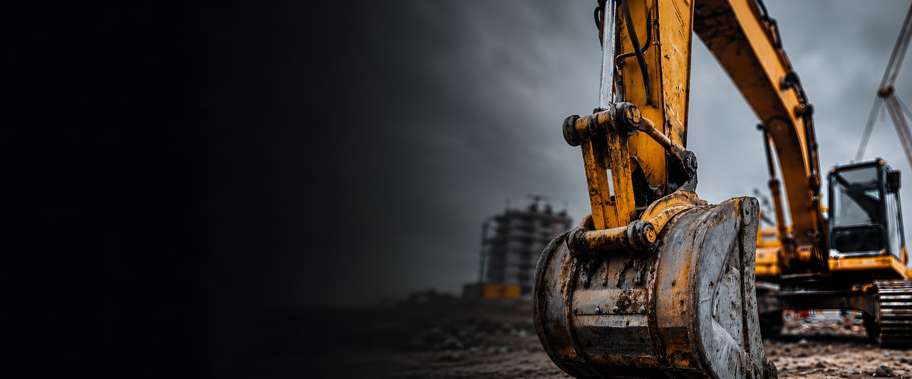 Ein großer Bagger auf einer Baustelle, ausgestattet mit hochwertigen Dichtungen von HP.