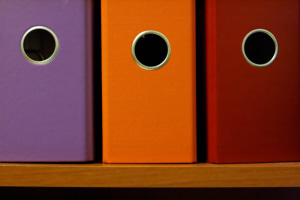 Some binders on the shelf