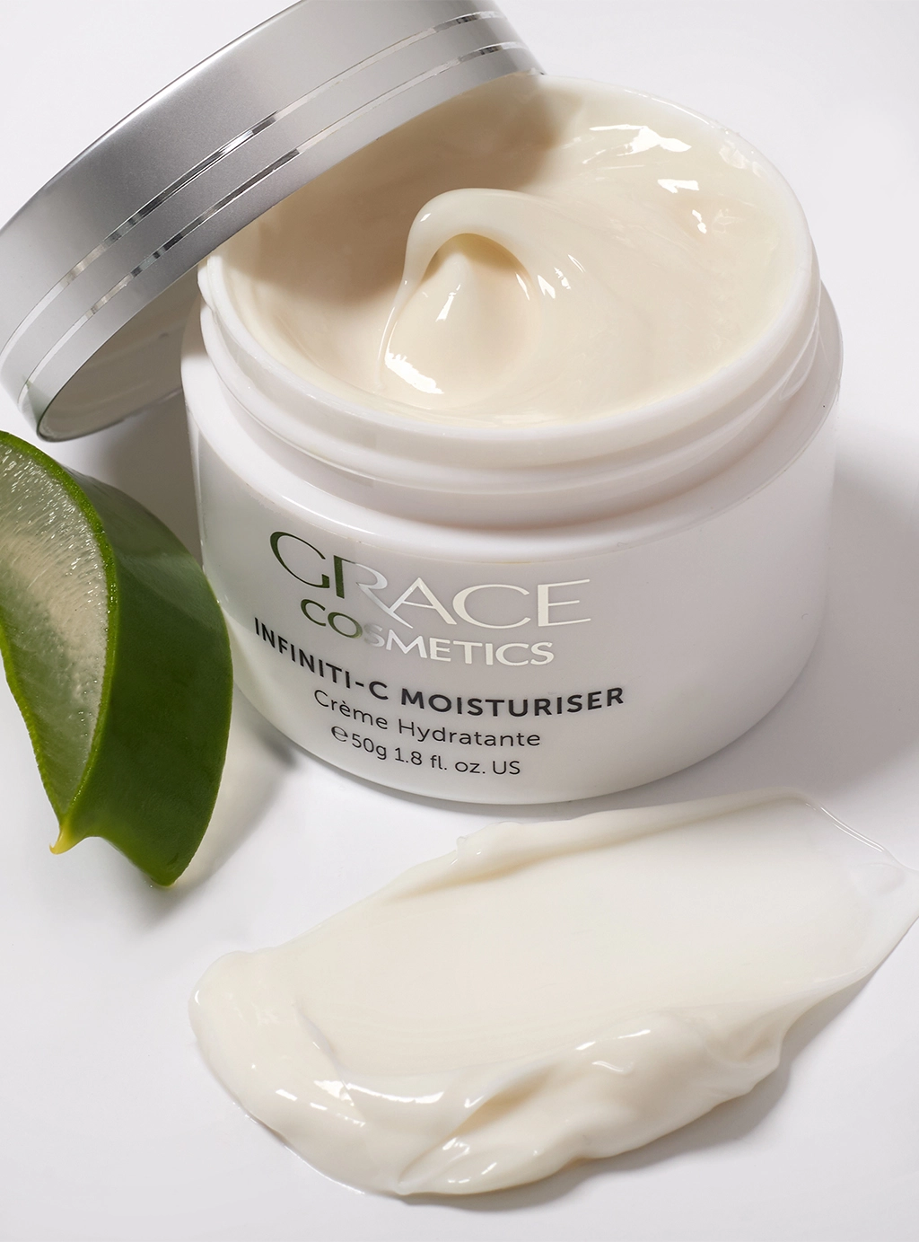 Close up of Infiniti-C Moisturiser product texture with slices of aloe