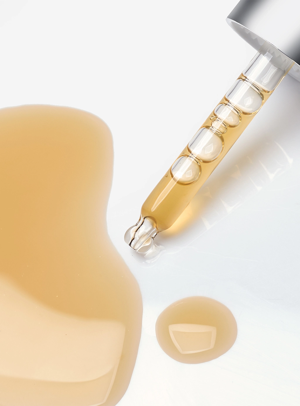 Close up shot of Infiniti Beauty Fluids texture and dropper