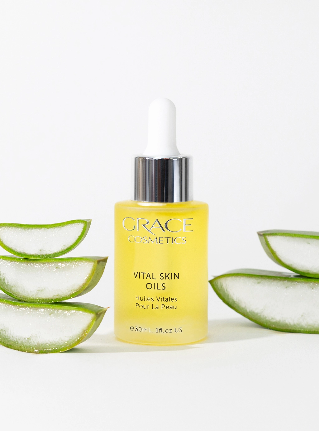 Close up shot of Vital Skin Oils with aloe vera slices