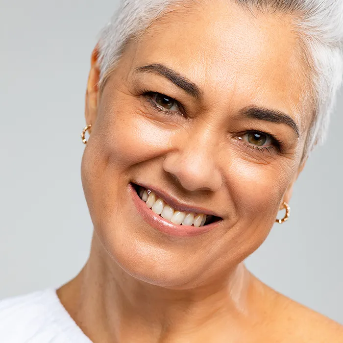 Portrait of a woman with blonde hair smiling