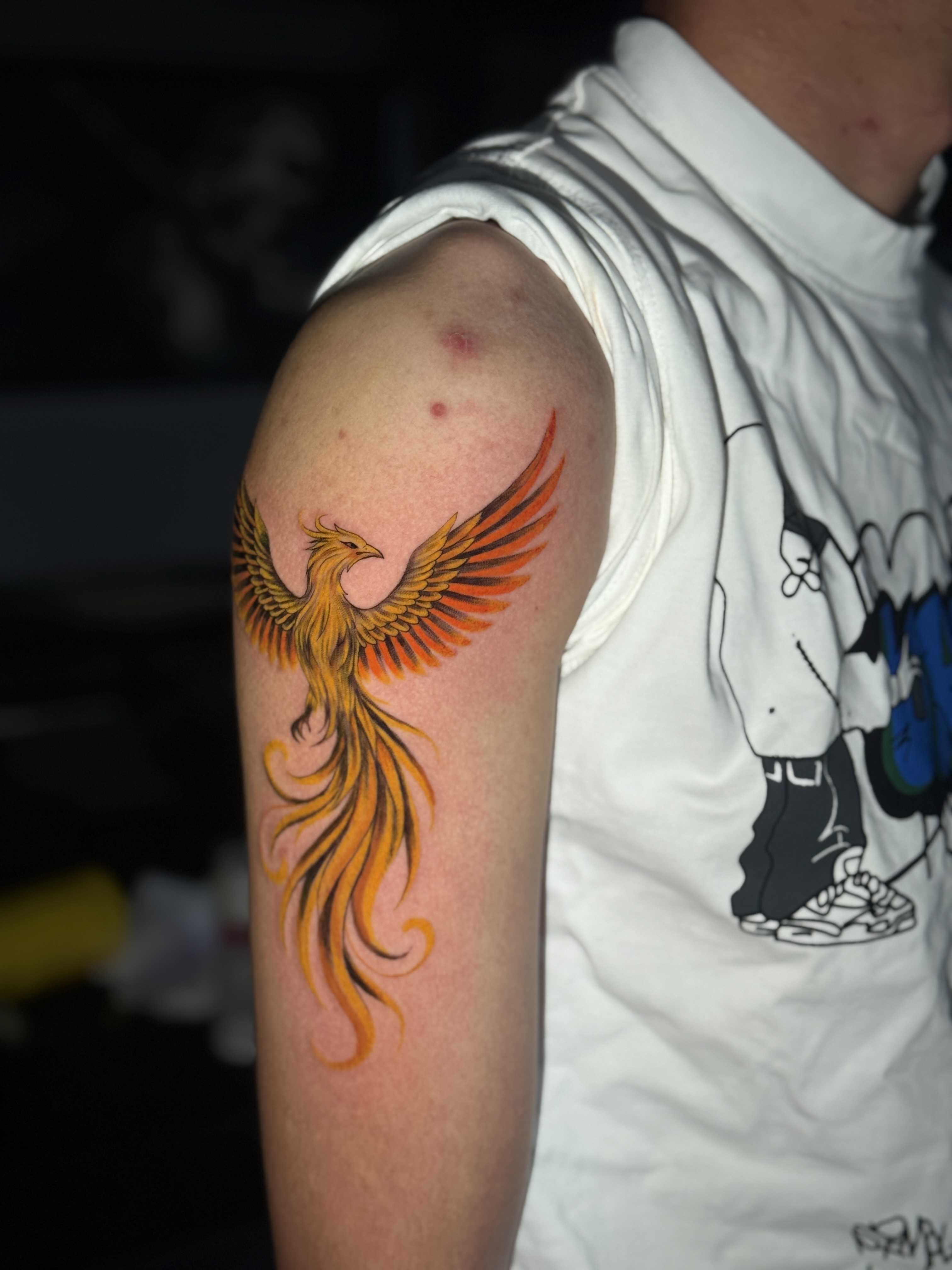 Phoenix tattoo on bicep