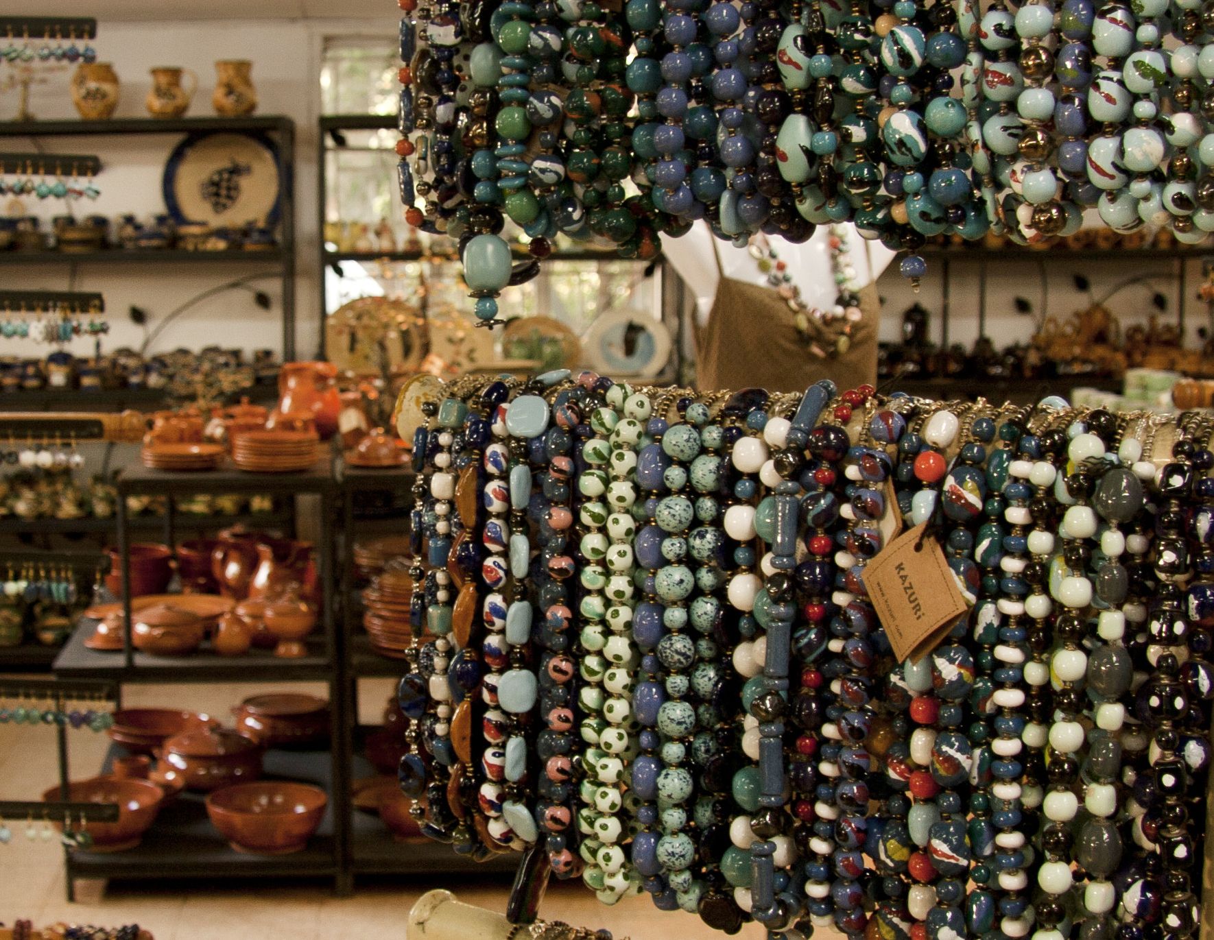 Visitors admiring traditional beadwork at Kazuri Beads factory in Nairobi, Kenya"