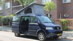 powerful VW T5 Multivan camper van with spacious Reimo pop-up roof