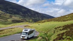 luxury camper including queen-size bed, pull-down bed and large garage and tow bar