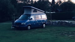 Cheerful Volkswagen camper van with lifting deck and pull-out bed for 2 people