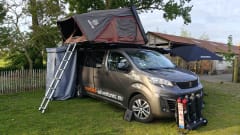 The AdventuresVan β Off-grid custom-made campervan with roof tent