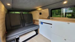 4-person Volkswagen with pop-up roof and long wheelbase for extra space