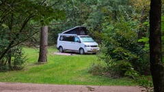 cool and cozy off grid camper van with lifting roof.