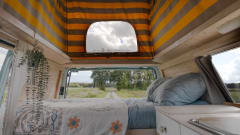 Retro turquoise camper, ready for a road trip. 