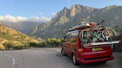 Red Volkswagen bus California T5