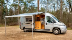 2 person bus camper with fixed bed and sanitary facilities