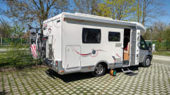 Comfortable motorhome with queen bed and electric bicycle carrier 