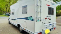 Attractive camper with fixed bed and easy to park