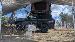 Cool Toyota Landcruiser with 2-person roof tent, unlimited km!