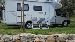 Comfortable motorhome with queen bed and electric bicycle carrier 